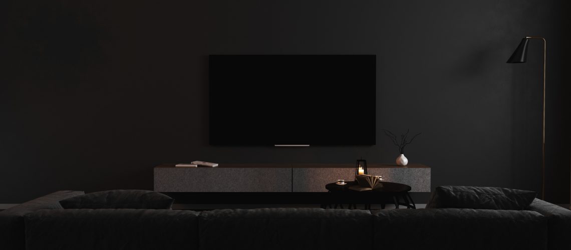Blank TV screen in modern dark interior with gray sofa in darkness mock up, front view. TV in living room interior background, empty TV display template, 3d render Blank TV screen in modern dark interior with gray sofa in darkness mock up, front view. TV in living room interior background, empty TV display template, 3d render